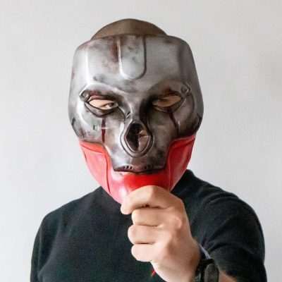 Guy holding a Revenants mask from Apex Legends